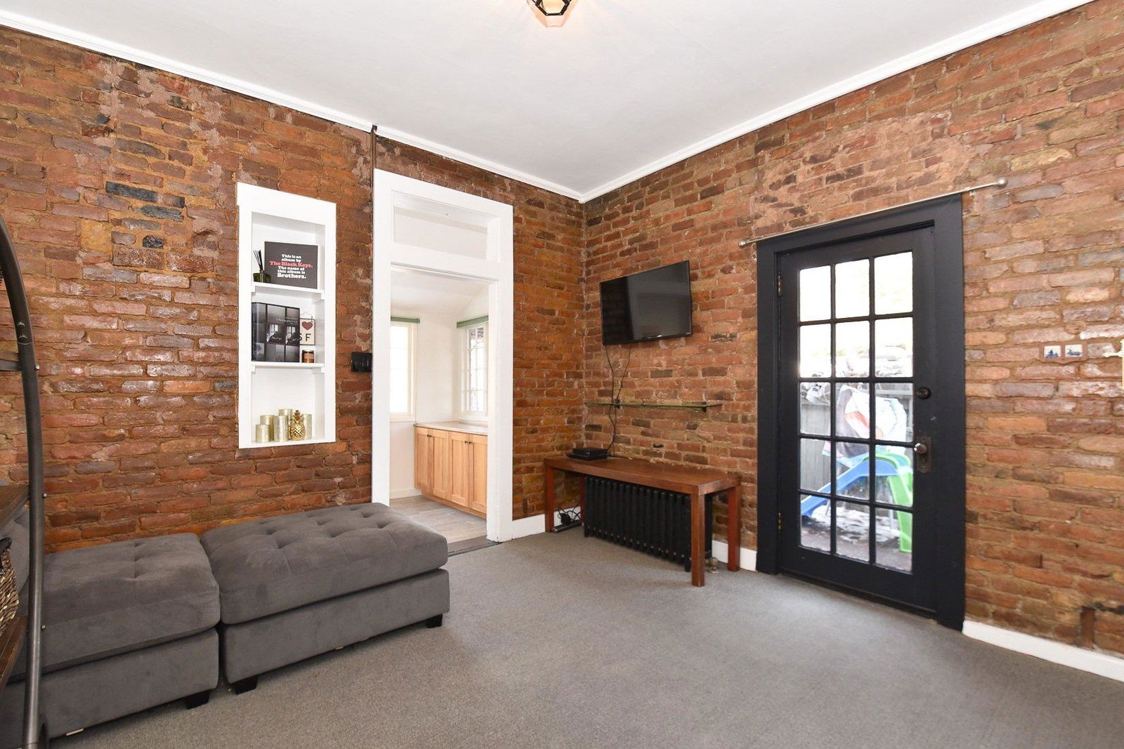 A living room with a couch and a television