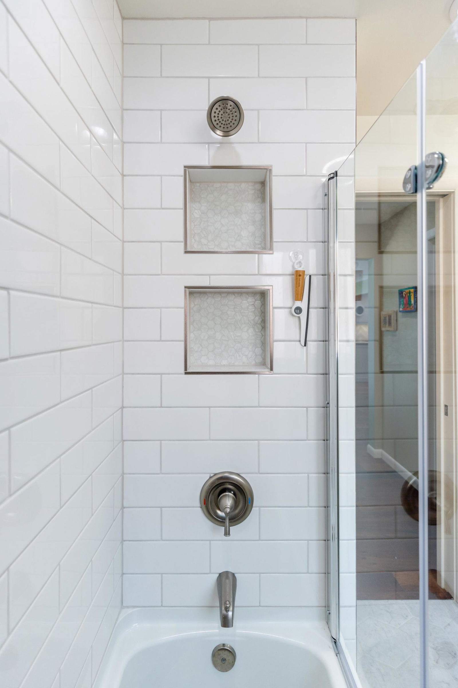 A bathroom with a sink and a shower