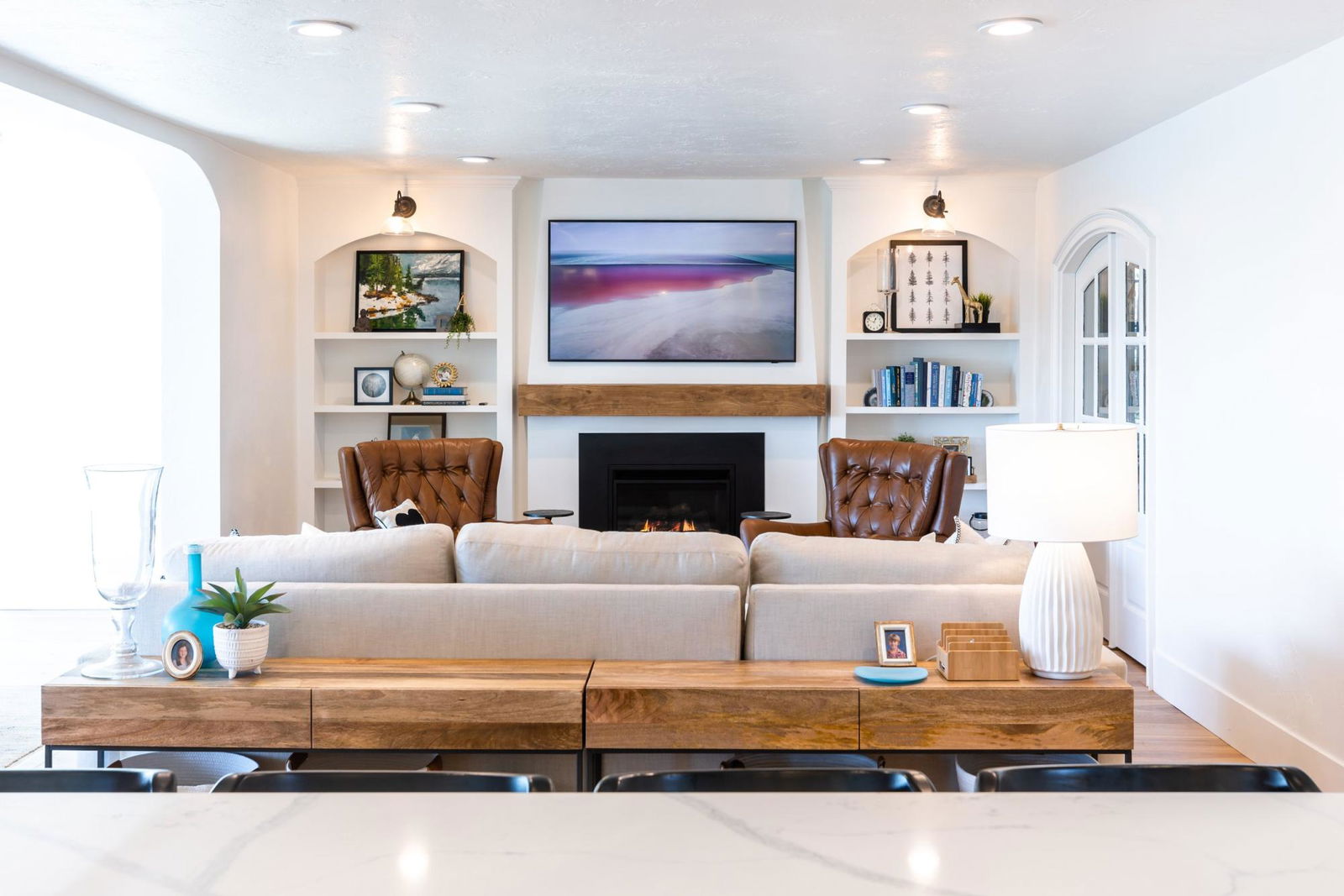 A living room filled with furniture and a fire place