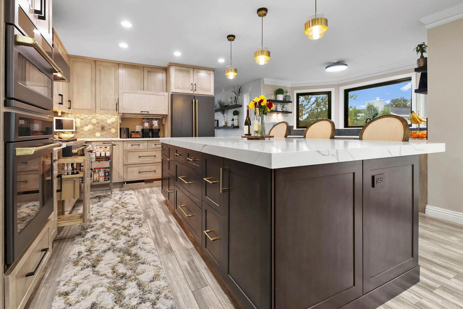 A large kitchen with a center island in the middle of the room