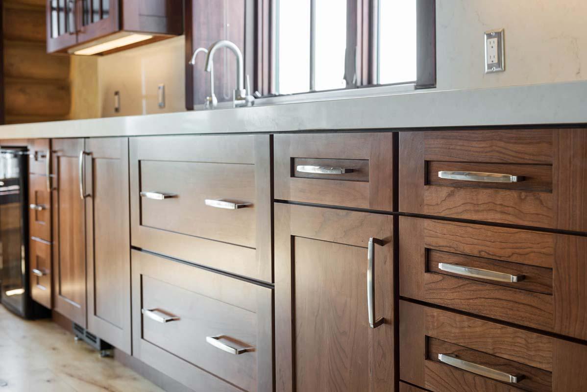 A kitchen with wooden cabinets and stainless steel appliances