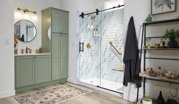 A bathroom with a walk in shower next to a sink