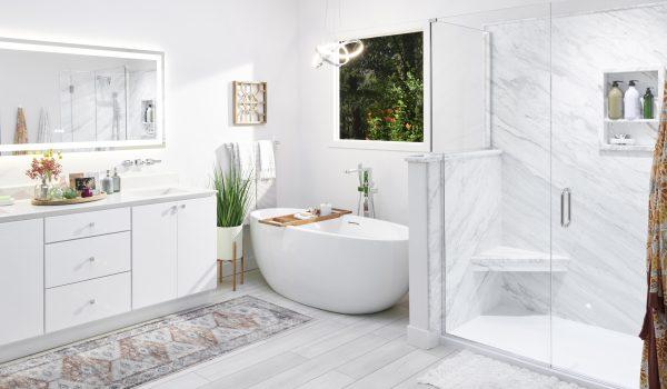 A white bathroom with a tub, sink, and shower