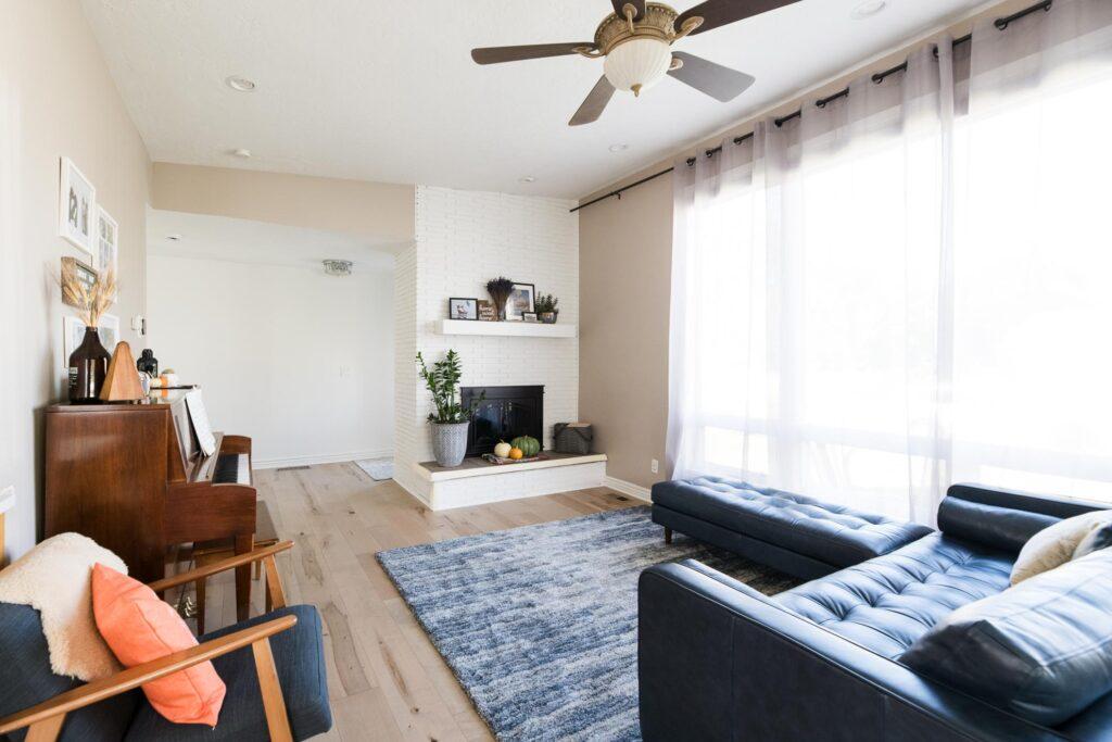 A living room filled with furniture and a fire place