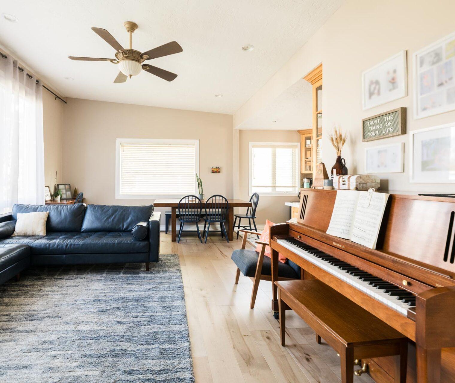 A living room filled with furniture and a piano