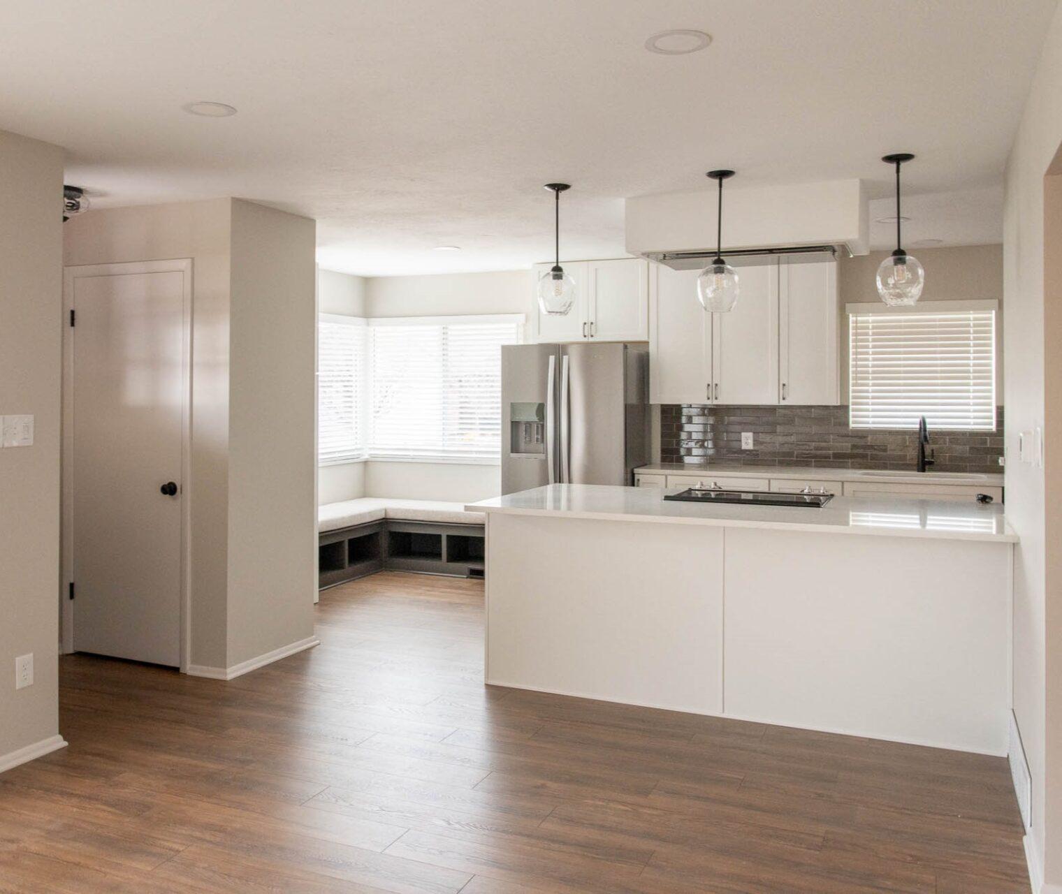 A large kitchen with a center island in the middle of the room