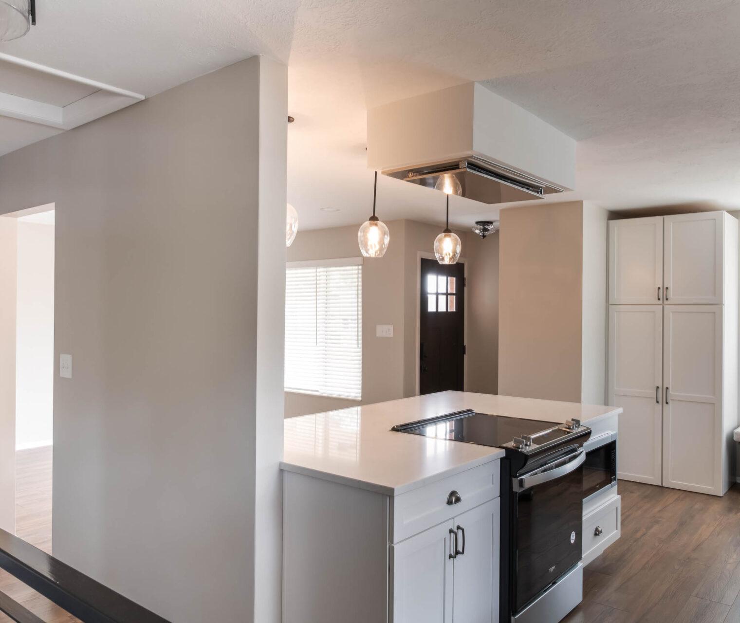 A kitchen with a stove top oven sitting inside of it