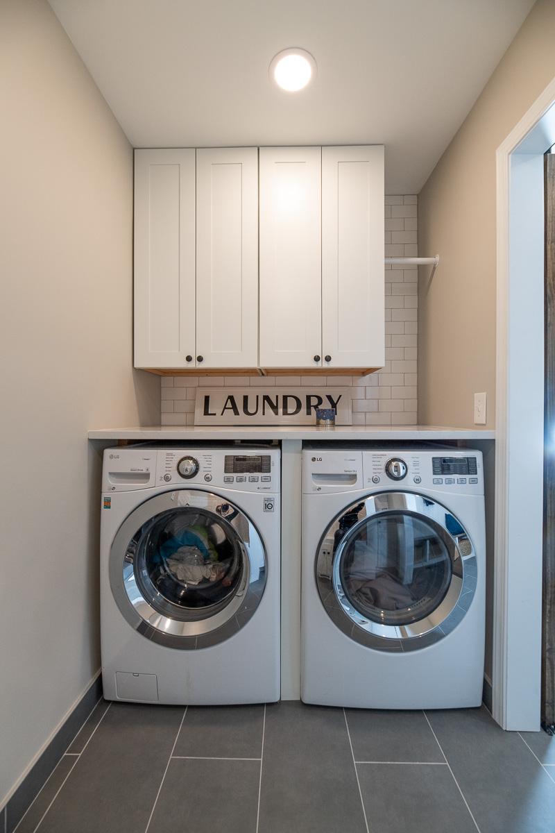 A laundry room with a washer and dryer