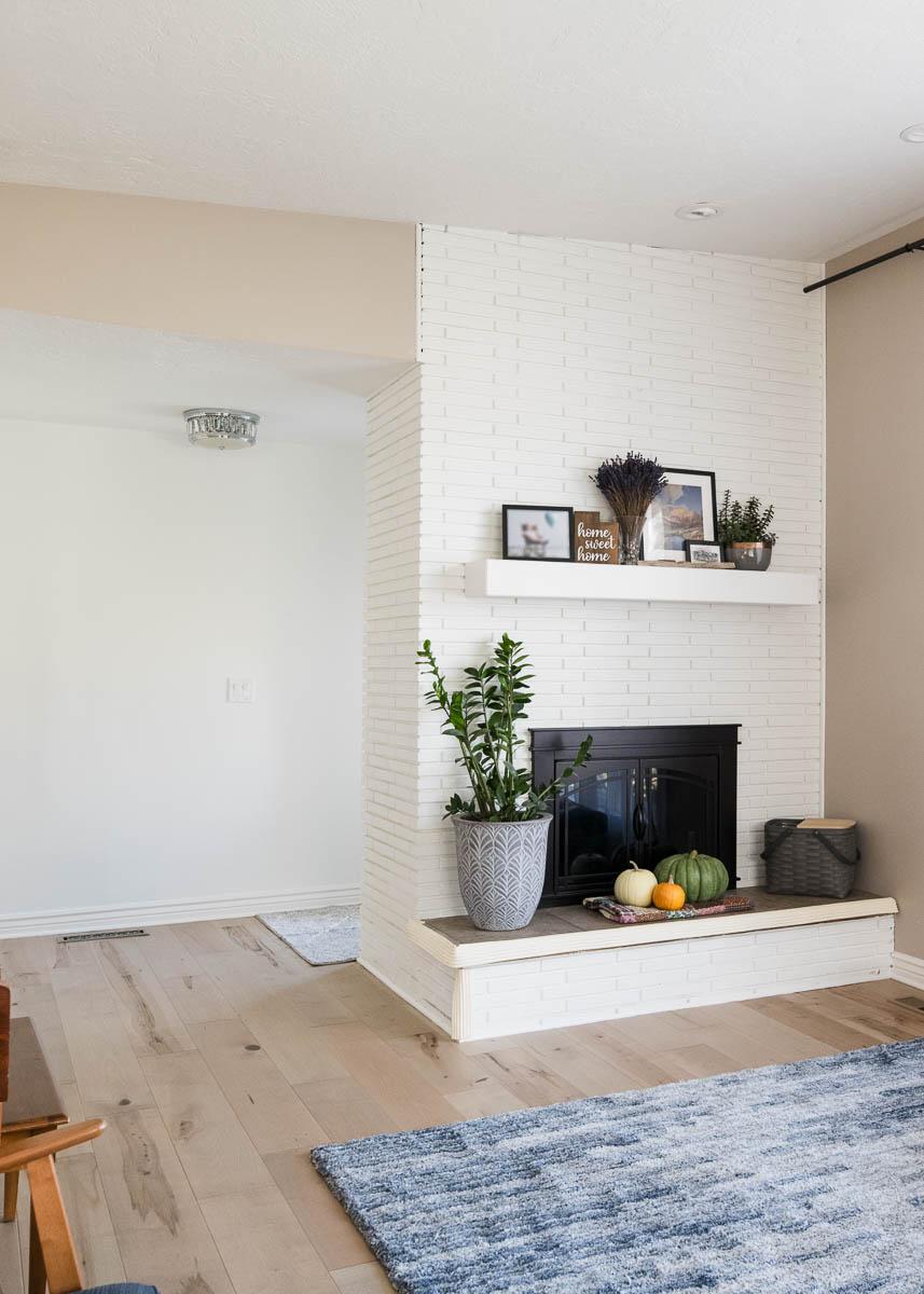 A living room filled with furniture and a fire place