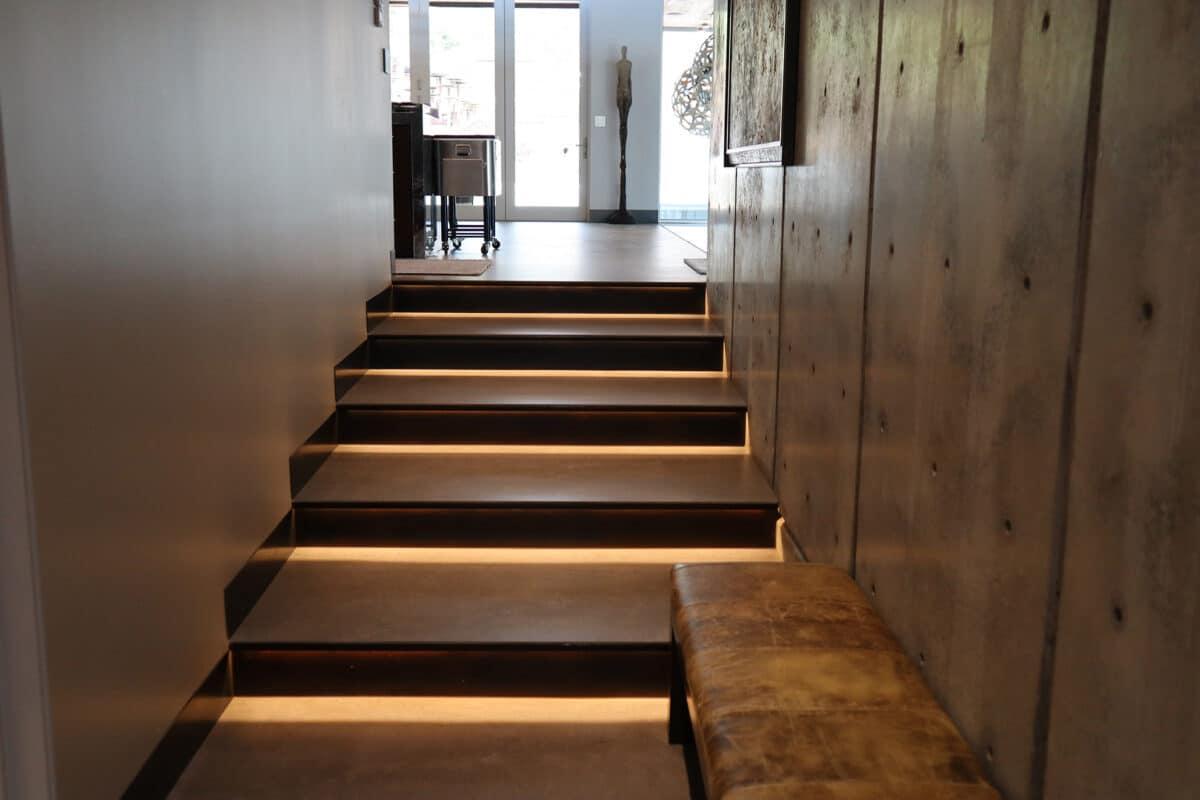 A set of stairs leading up to a living room