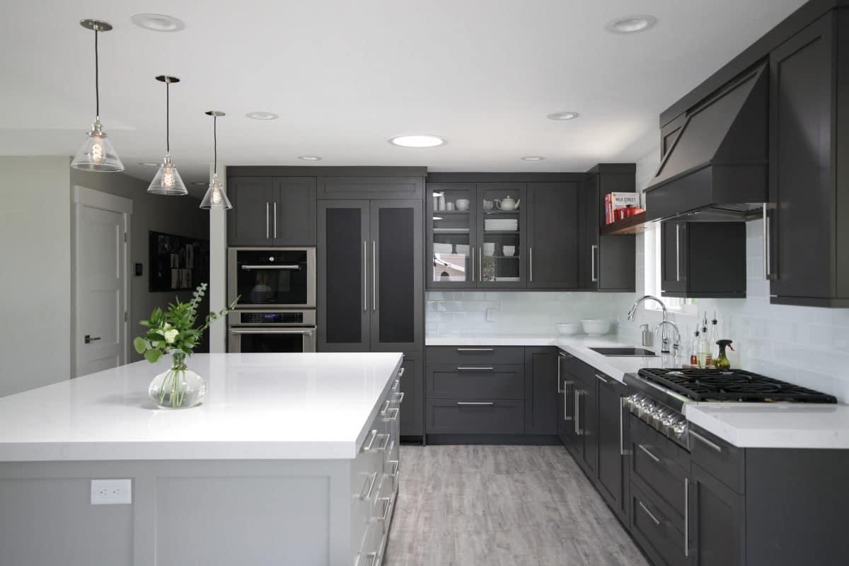 A large kitchen with a center island and stainless steel appliances