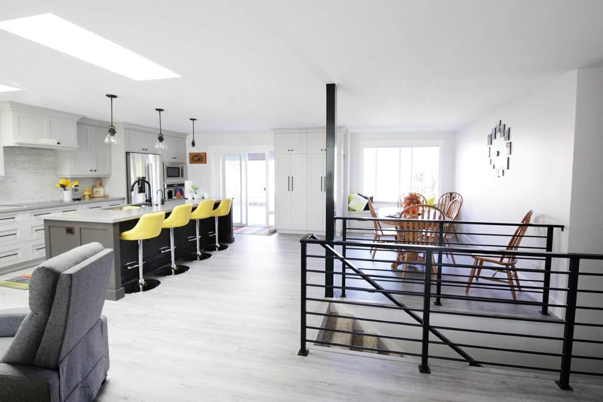 A kitchen with a table and chairs in it