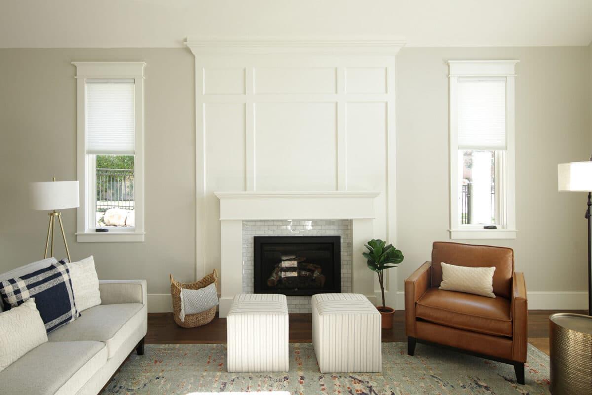 A living room filled with furniture and a fire place