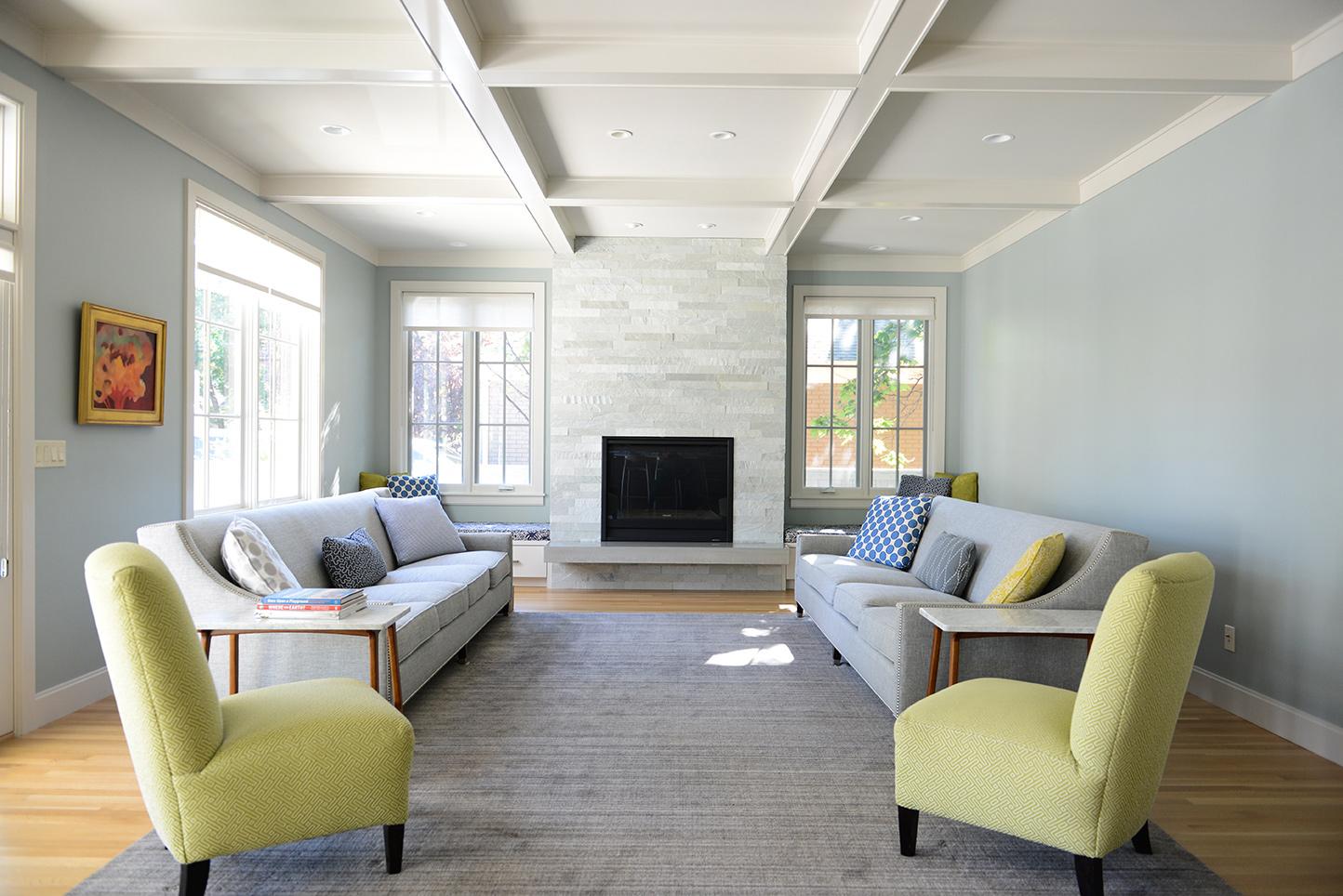 A living room filled with furniture and a fire place