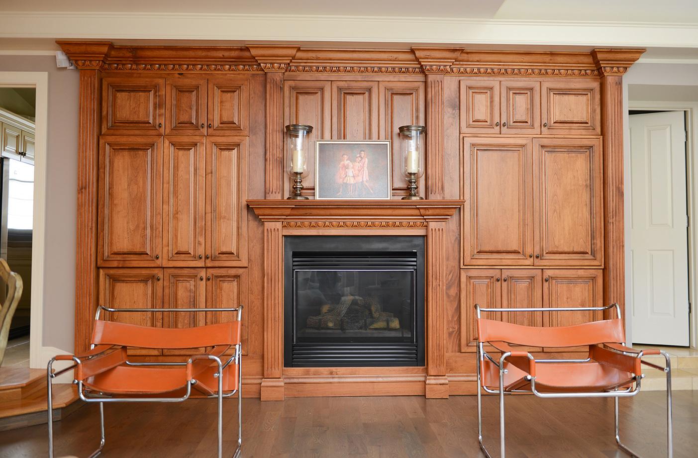 A living room with a fire place and chairs