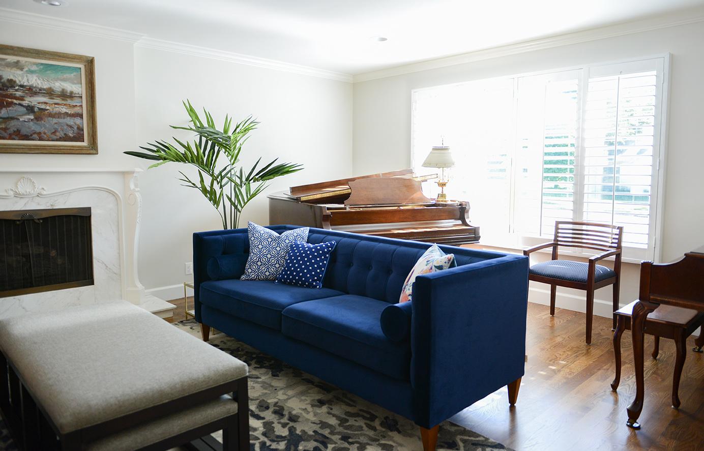 A living room filled with furniture and a fire place