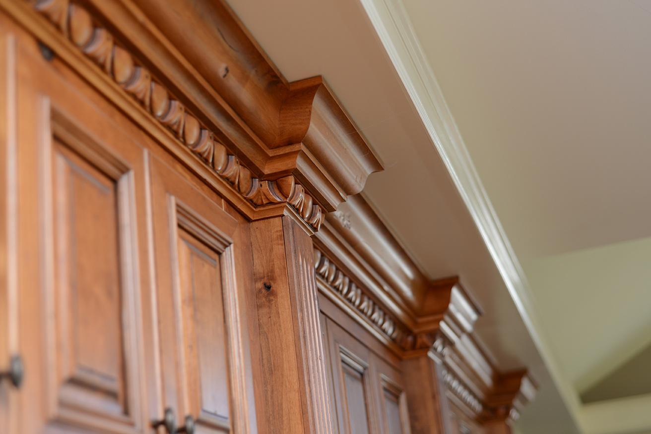 A close up of a wooden cabinet door