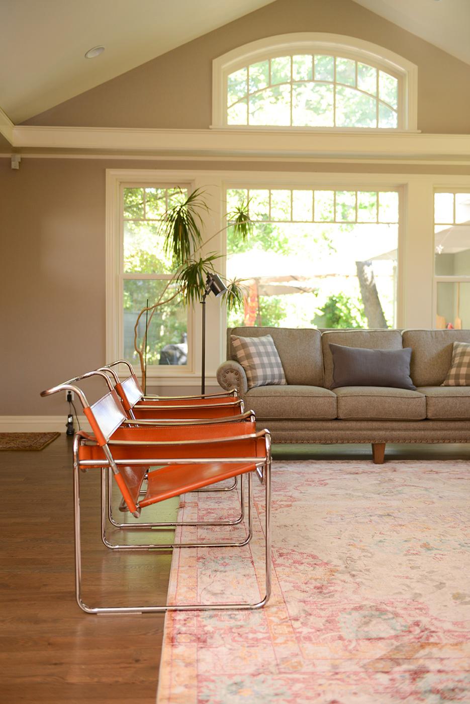 A living room filled with furniture and a large window