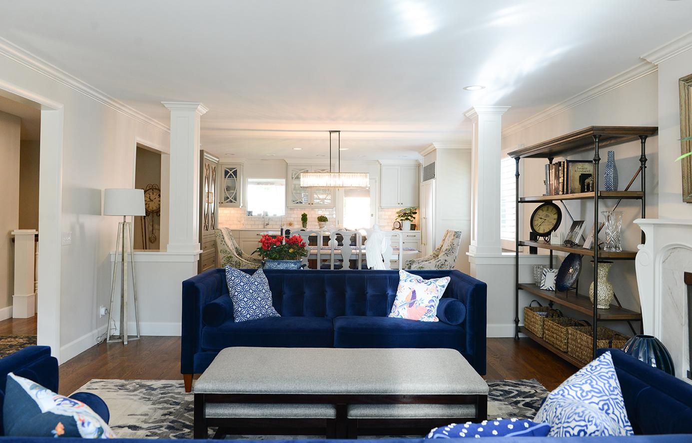 A living room filled with furniture and a fire place