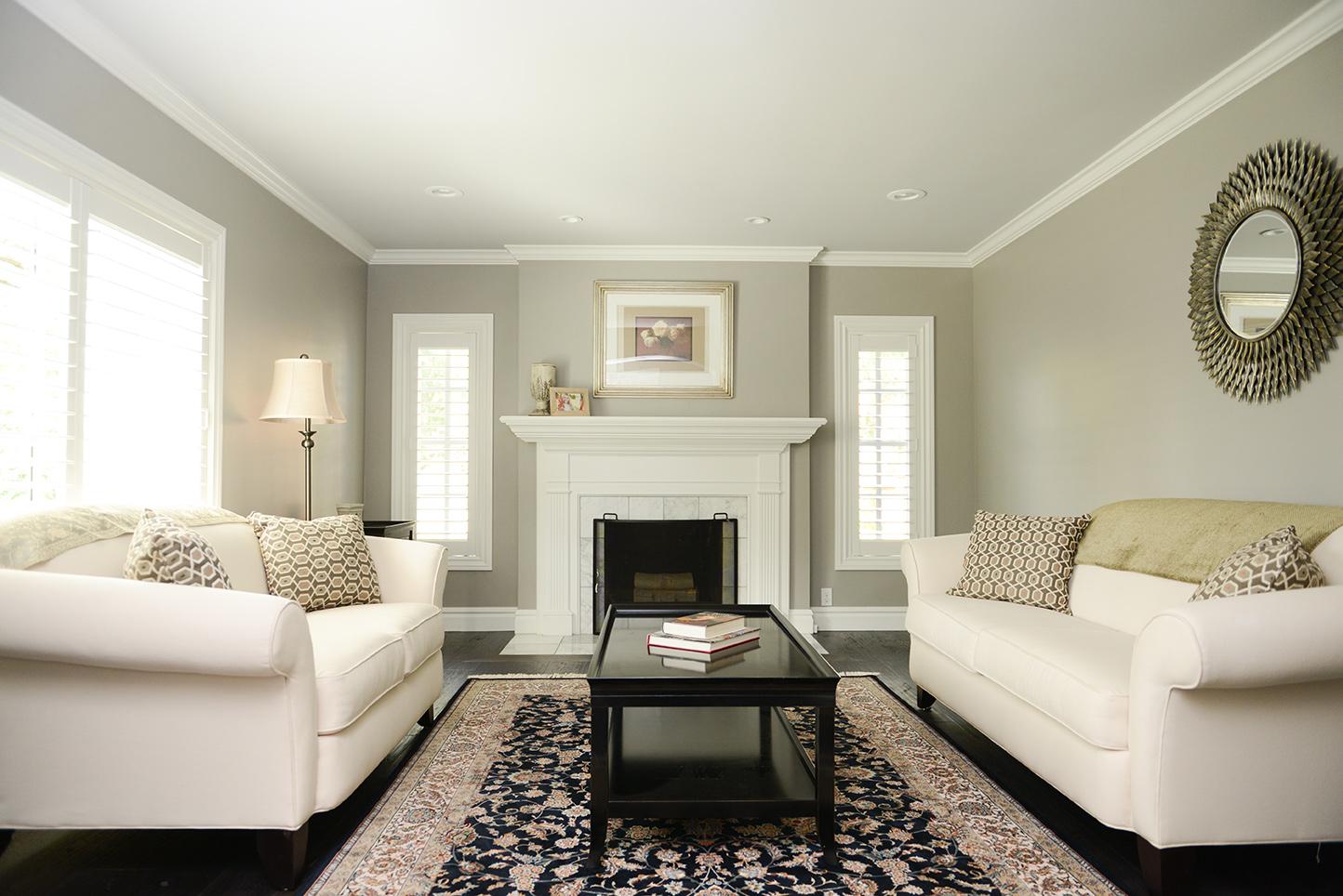 A living room filled with furniture and a fire place