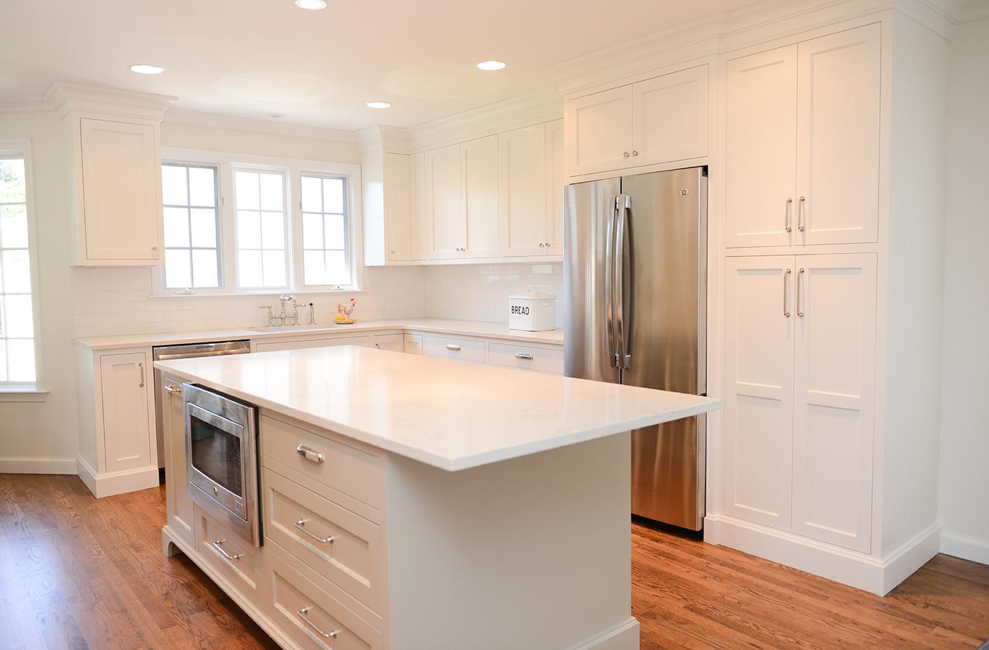 A large kitchen with a center island in the middle of the room