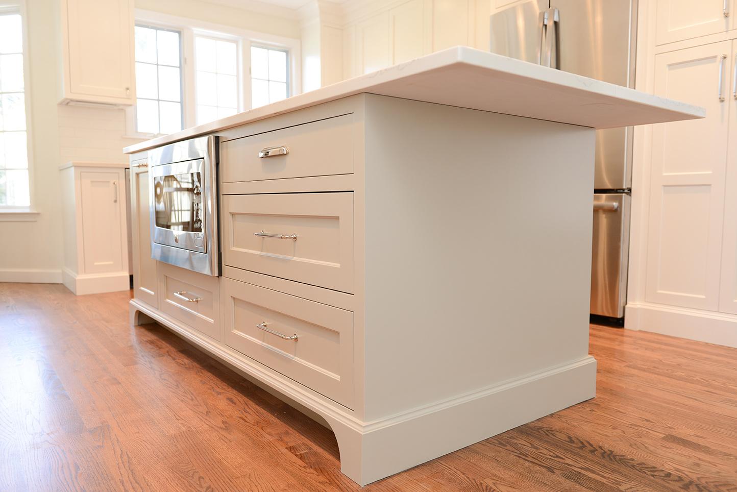 A kitchen with a large island in the middle of it