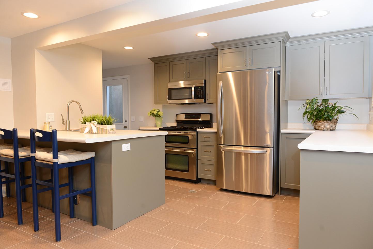 A kitchen with stainless steel appliances and a center island