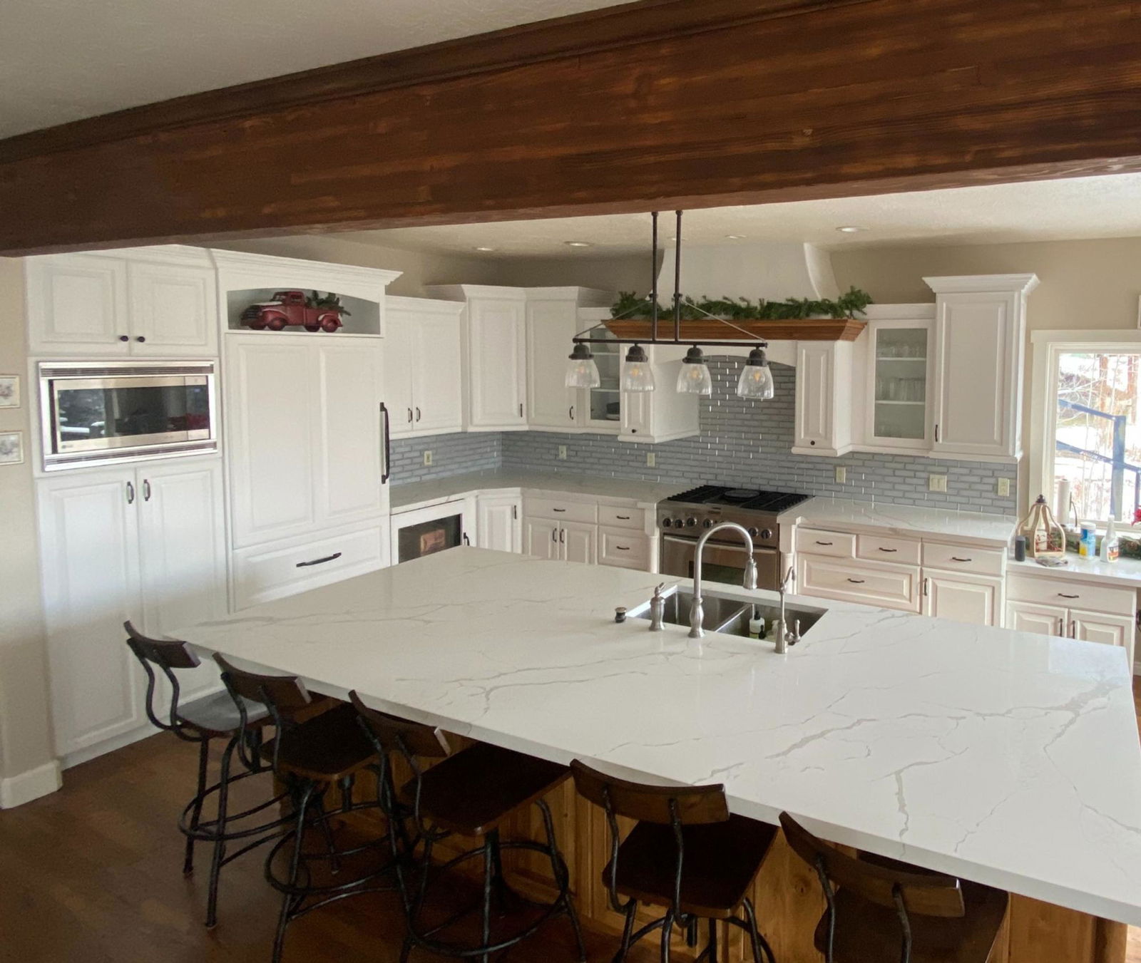 A large kitchen with a center island in the middle of the room