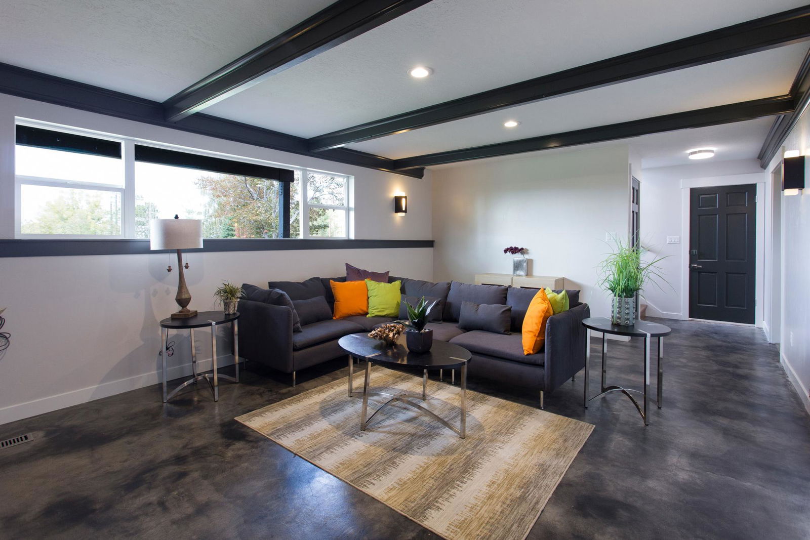 A living room filled with furniture and a large window