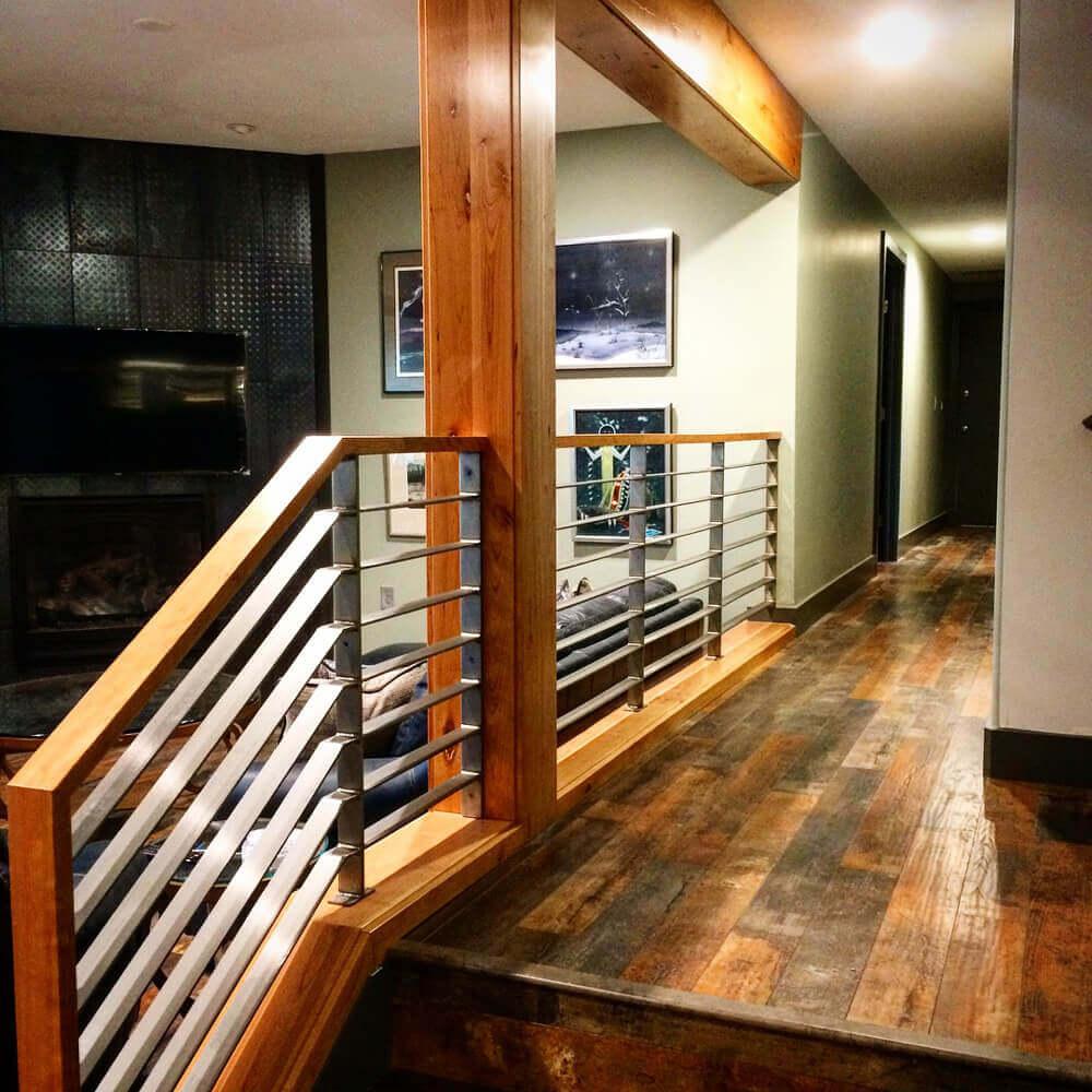 A wood and metal stair case in a house