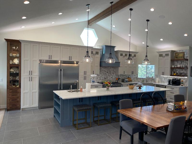 A large kitchen with a center island and a breakfast nook