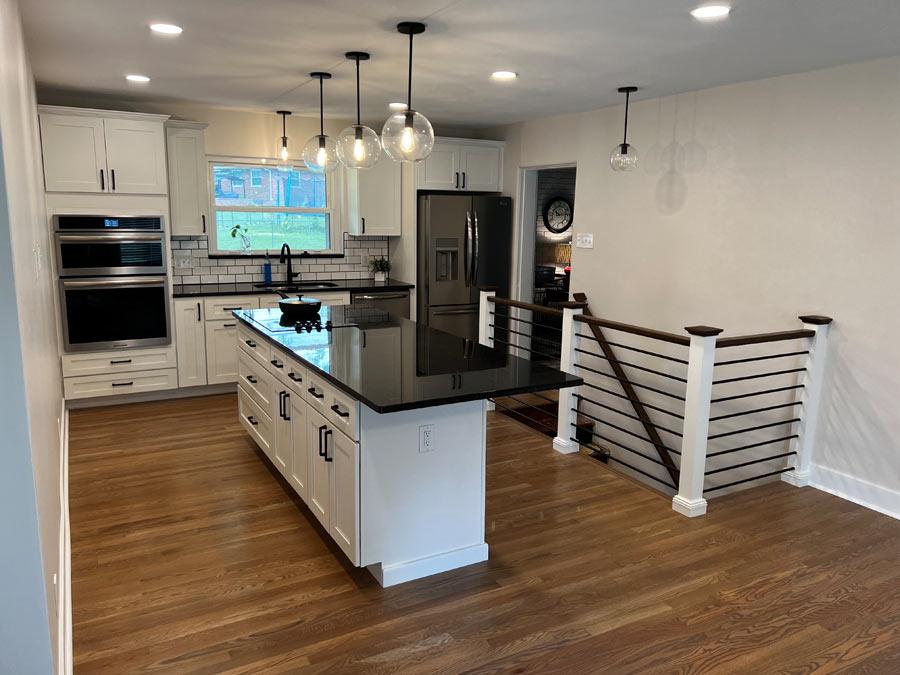 A large kitchen with a center island in the middle of the room