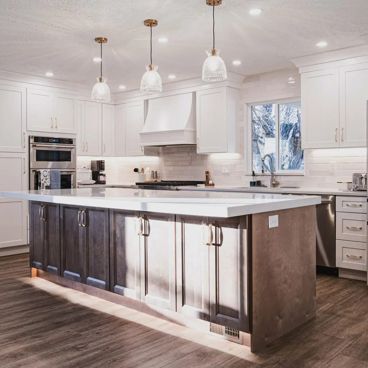 A large kitchen with a center island in the middle of the room