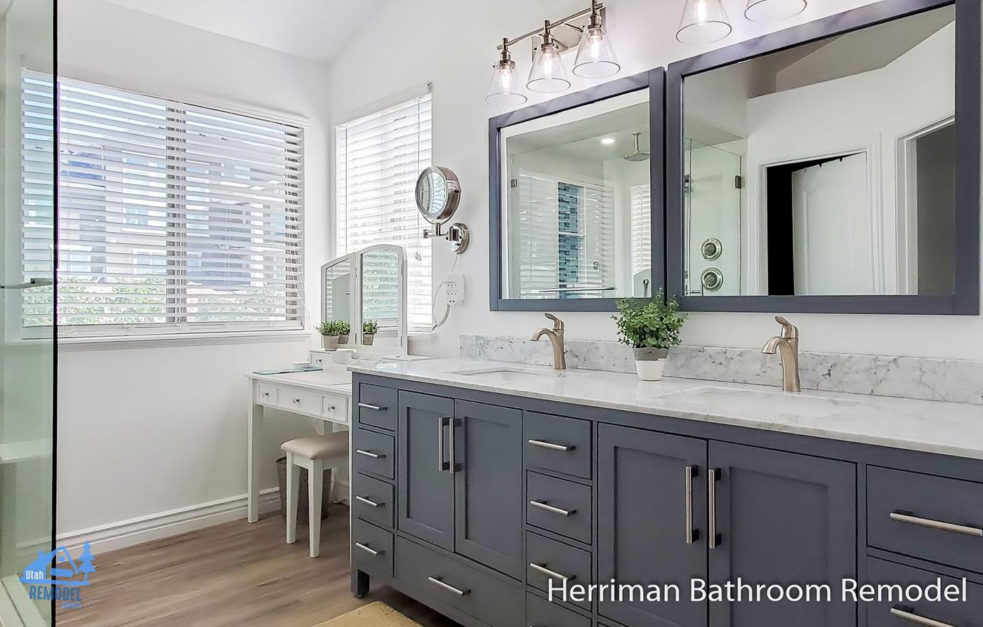 A bathroom with two sinks and a large mirror