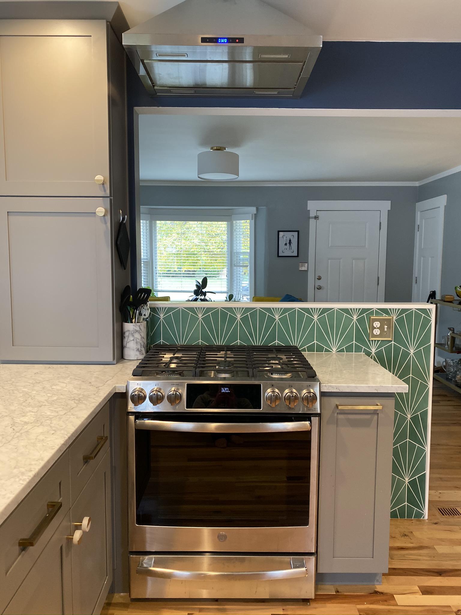 A stove top oven sitting inside of a kitchen